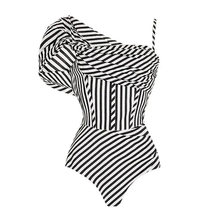 Women's striped one-piece swimsuit with ruffled design and black skirt overlay