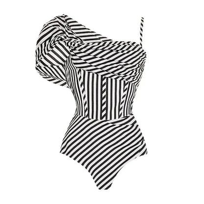 Women's striped one-piece swimsuit with ruffled design and black skirt overlay