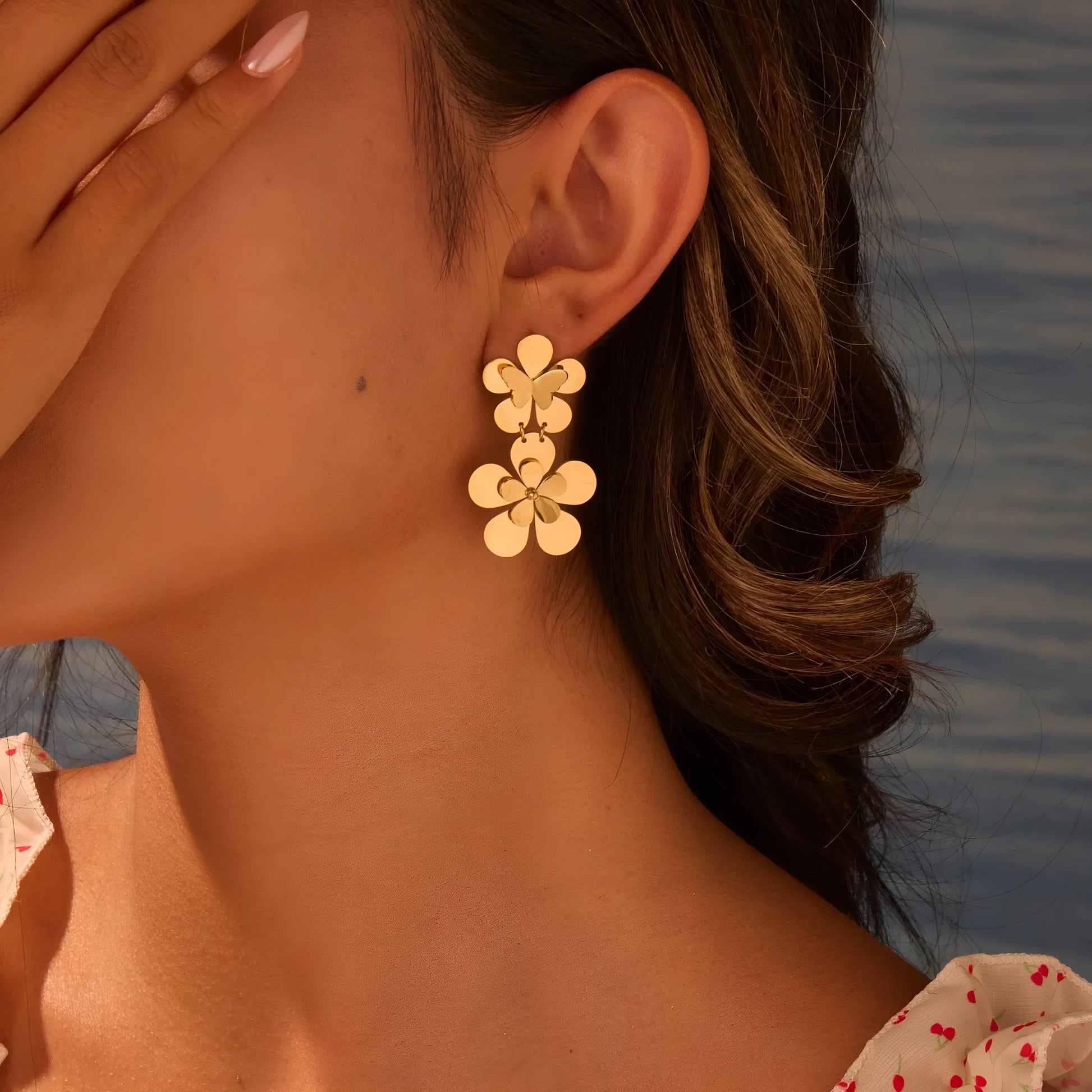 Gold colour flower butterfly stainless steel earrings for women with geometric and zodiac design elements