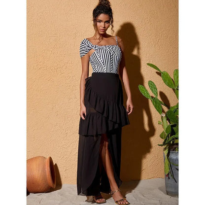 Women's striped one-piece swimsuit with ruffled design and black skirt overlay