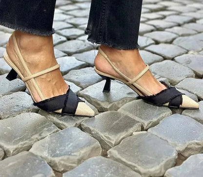 Women's apricot and black colour block pointed-toe sandals with a stiletto heel and an adjustable buckle fastening.