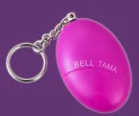 Compact black personal alarm keychain with pull-ring for loud siren activation, shown next to a ruler showing 6cm length.