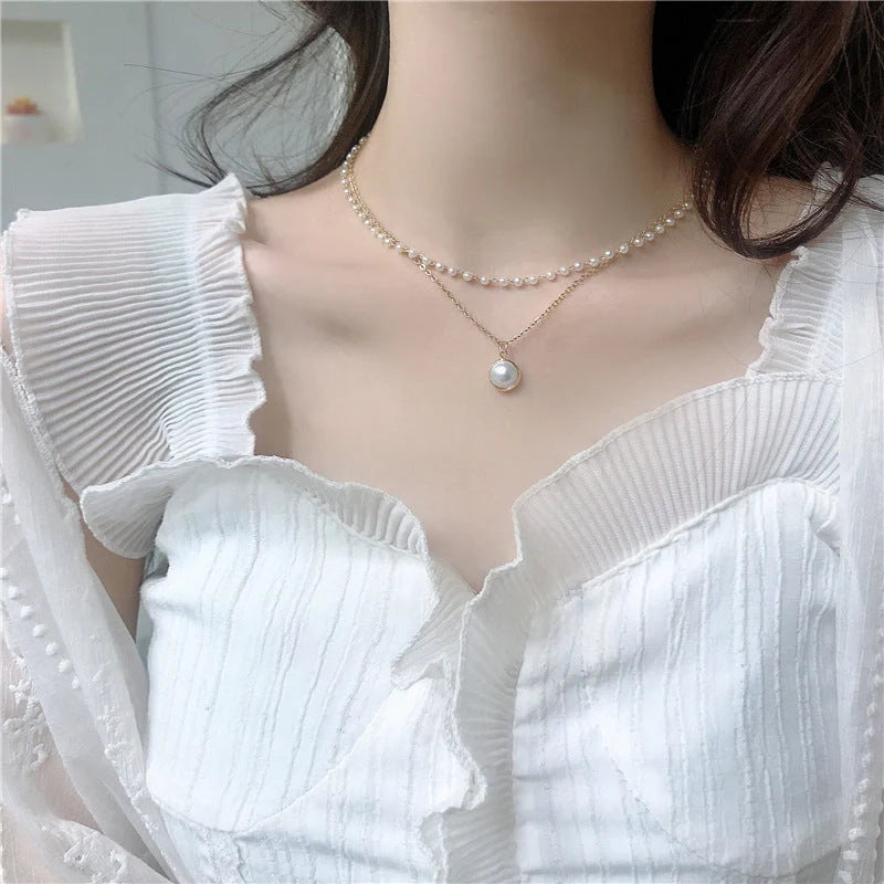 Elegant double-layer pearl necklace for women in gold, showcasing sophisticated design and high-quality craftsmanship.