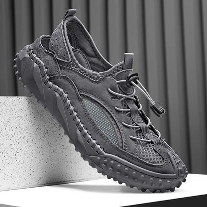 Men's black waterproof wading sandals with elastic band and perforated leather mesh upper on a rubber sole.
