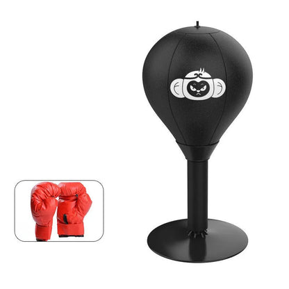 Tabletop boxing speed ball with suction cup base on a desk, showing burst bear design and flexible connection tube