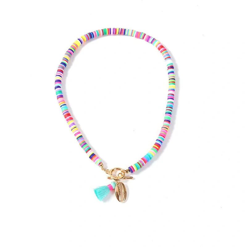Bohemian shell tassel necklace for women featuring a unique shell charm and soft ceramic alloy tassel.