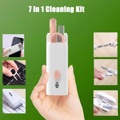 White electronics cleaning kit with a cleaning pen, spray bottle, brush, and keycap puller on a table