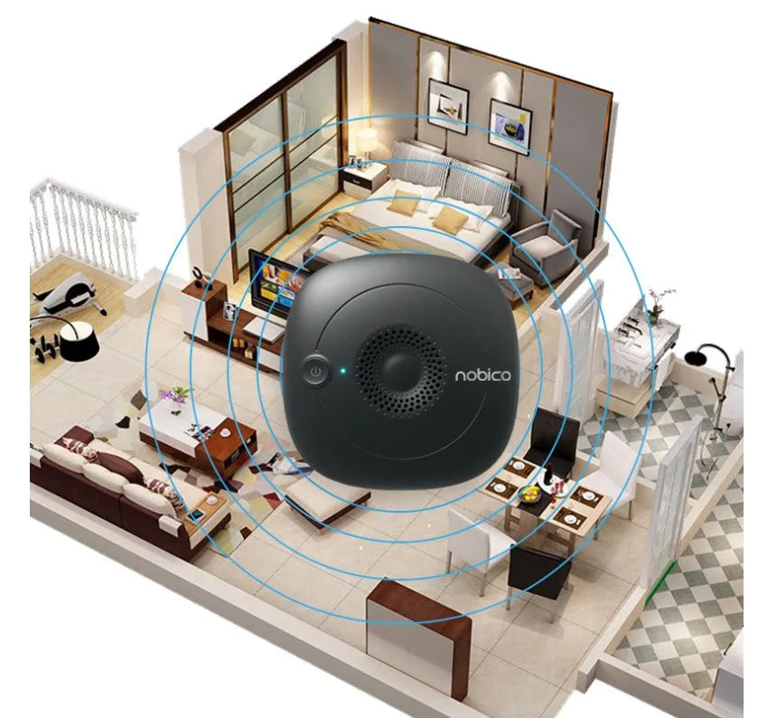 Compact black ultrasonic bed vacuum cleaner for mite repellent on a mattress.