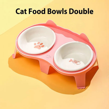 Ceramic cat food and water bowl set in elevated tilted stand, shown in blue, pink, white, and yellow colour options.