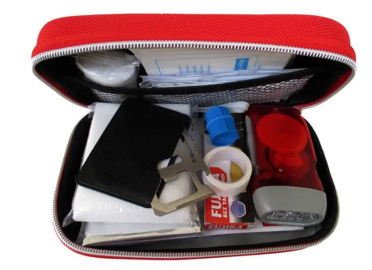 Red plastic survival first aid kit open to show 18-piece contents including bandages, scissors, and emergency blanket.