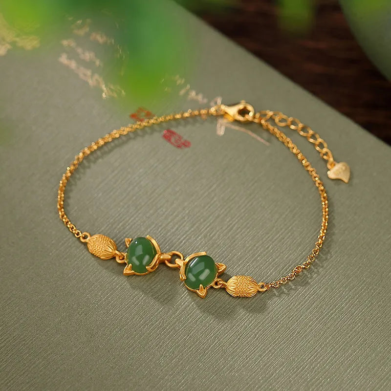 Retro-style women's silver bracelet with a jade centrepiece and extension chain.