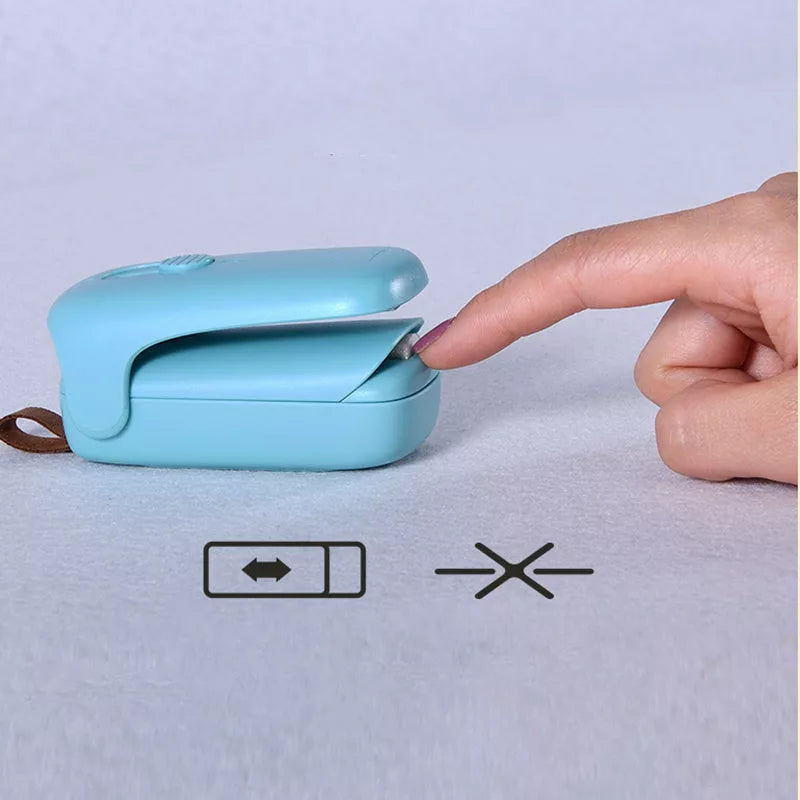 Mini sealing machine in blue with double electric heating wire for secure plastic bag seals