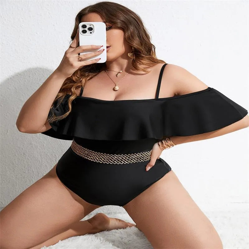 Black solid colour one-piece swimsuit for women on a mannequin.