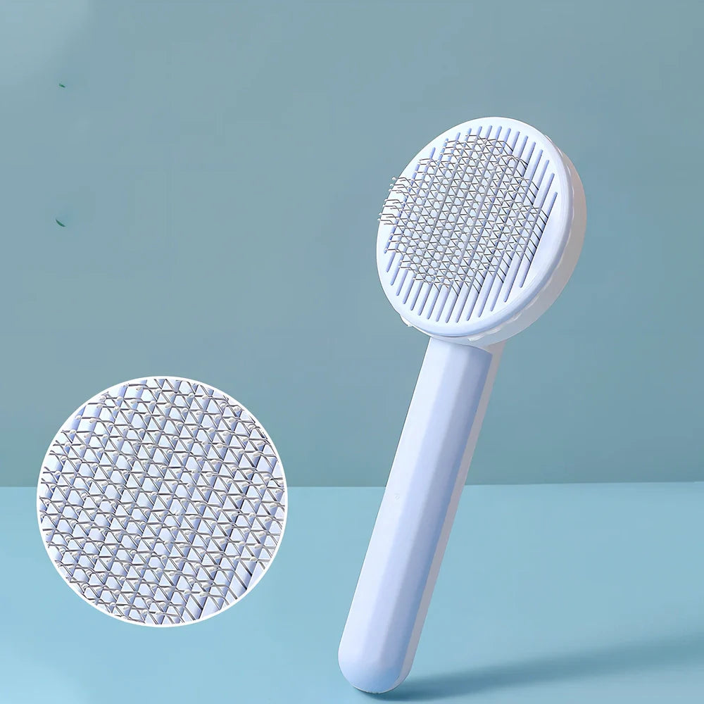 Self-cleaning cat comb with floating needle teeth and built-in hair storage chamber in assorted colours