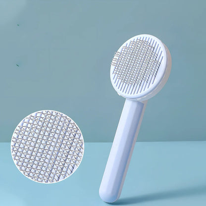 Self-cleaning cat comb with floating needle teeth and built-in hair storage chamber in assorted colours