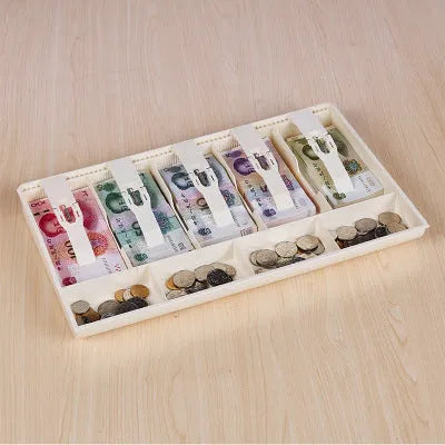 Black and white five-drawer ABS plastic cash register box for organising banknotes and coins.