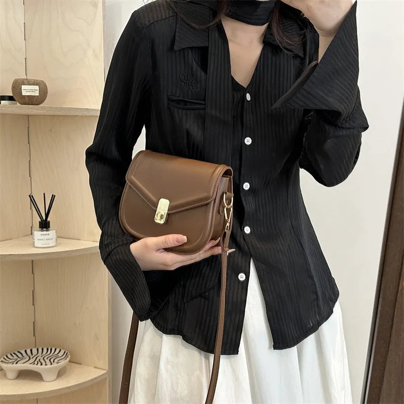 Soft PU leather messenger bag with textured finish in horizontal rectangular shape