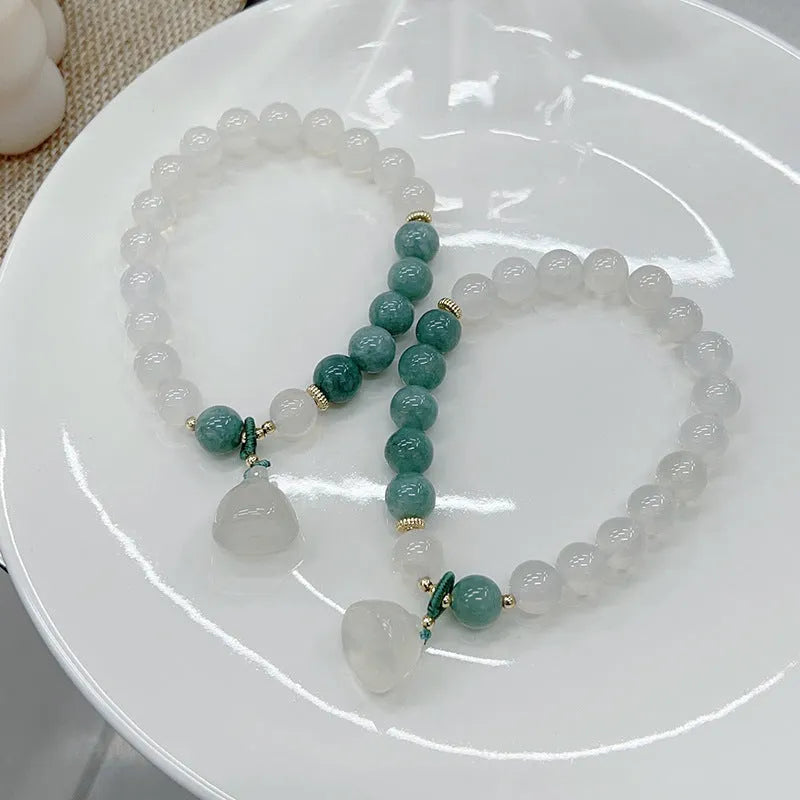 Women's retro Chinese style agate lotus seedpod bracelet showing natural stone patterns