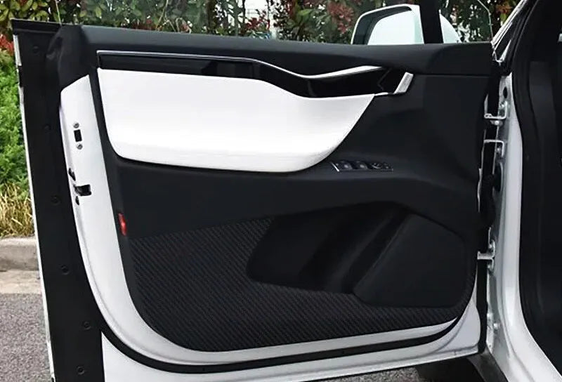 Carbon fibre protective film for Tesla Model S car doors showing four-piece set for front and rear door coverage