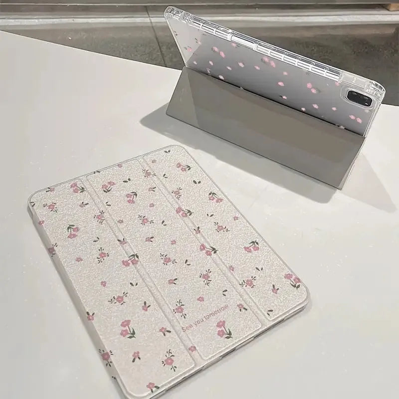 Transparent floral print hard case for iPad with tri-fold magnetic front cover acting as a kickstand.