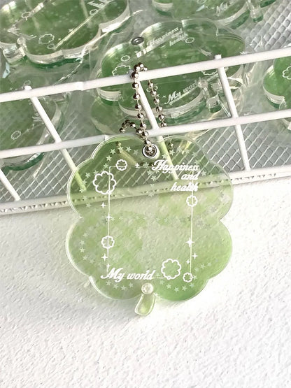 Four-leaf clover shaped acrylic phone pendant keychain in blue, green, and mint colour options