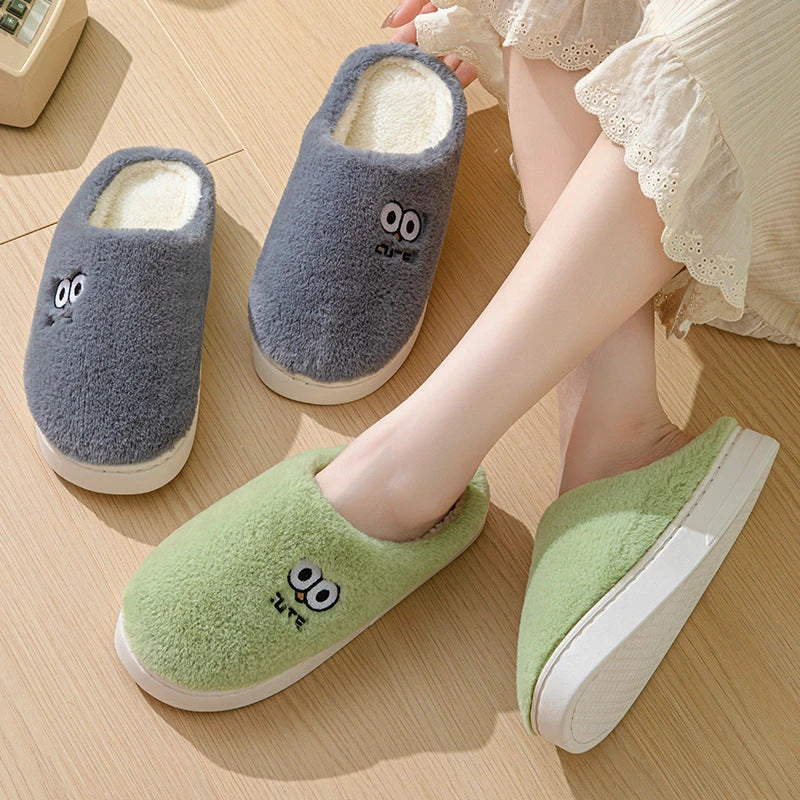 Stylish and cozy cartoon-inspired slippers with plush material and non-slip rubber soles, perfect for keeping feet warm and comfortable at home.