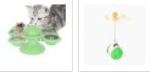 Cat playing with rotating windmill toy featuring luminous balls and suction base