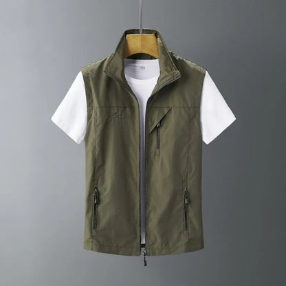 Man wearing a slim-fit hooded waistcoat made of rabbit fur in a casual outdoor setting.