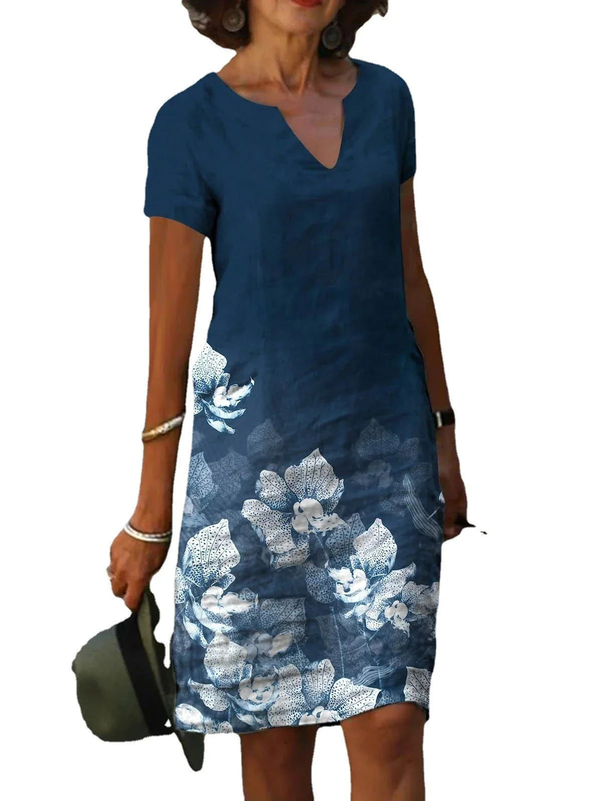 Elegant floral-printed cotton and linen midi dress in various colours with short sleeves and v-neck