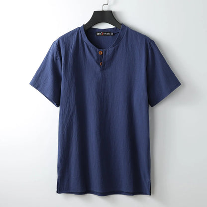 Women's loose fit apricot cotton V-neck short sleeve pullover top on a hanger.