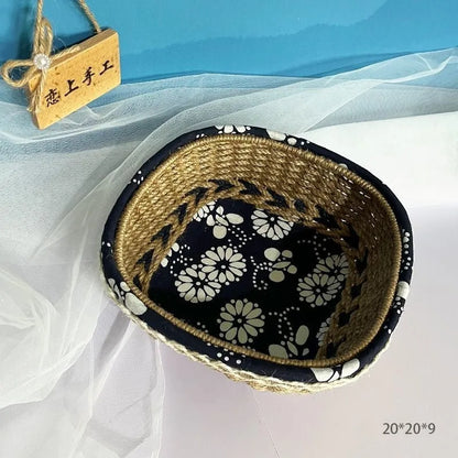 Blue square plastic storage basket with hand-woven sides for organising household items.