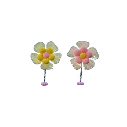 Small plastic car decoration swing measuring 5cm tall in blue, green, pink, purple, and yellow colour options