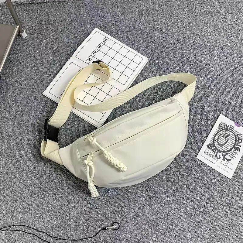 Men's small black polyester crossbody chest bag with adjustable strap.