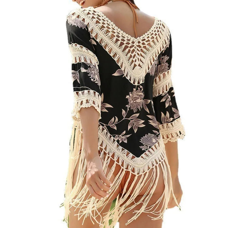 Women's apricot sun protection blouse with V-neck and hollow-out sleeves on a beach background.