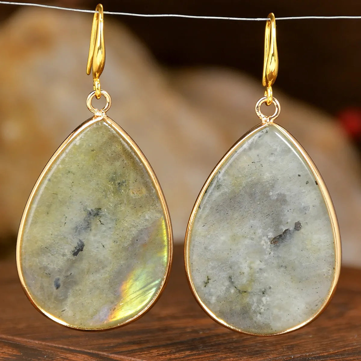Women's retro-style drop earrings with a natural stone pendant in a water drop shape on an electroplated setting.