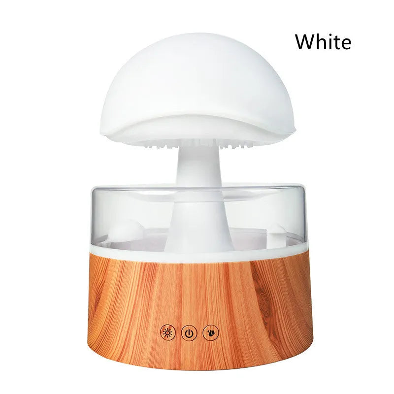 White cloud-shaped humidifier emitting mist with multicoloured LED light and water droplets