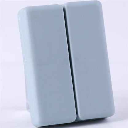 Blue foldable pill box with seven compartments and magnetic closure showing open and closed positions