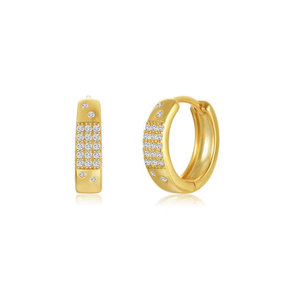 Pair of golden geometric clip-on earrings with a round design and screw-back mechanism on a white background.