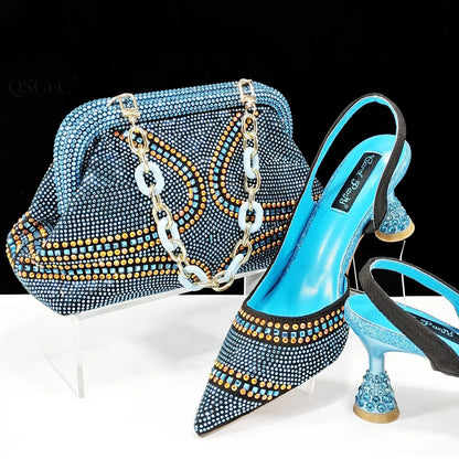 Women's pointed toe high heels with rhinestones and a matching small bag in blue.