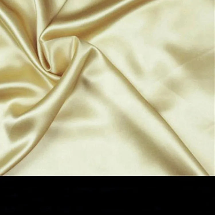 19 M double-sided silk pillowcase in champagne colour showing smooth texture and hem detailing