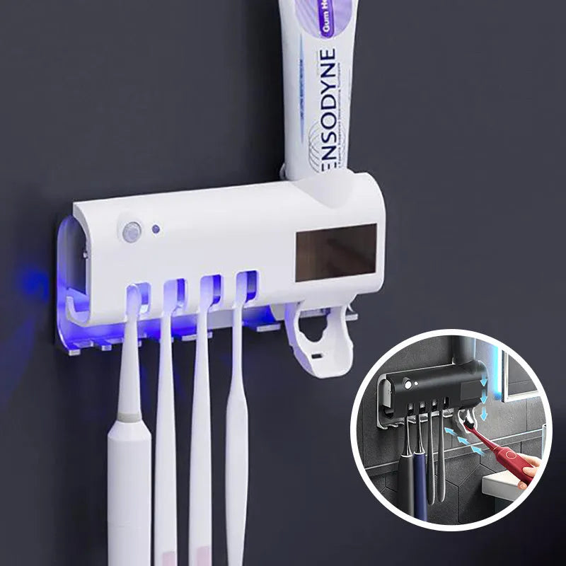 Black wall-mounted UV toothbrush steriliser with automatic toothpaste squeezer showing infrared sensor and solar panel