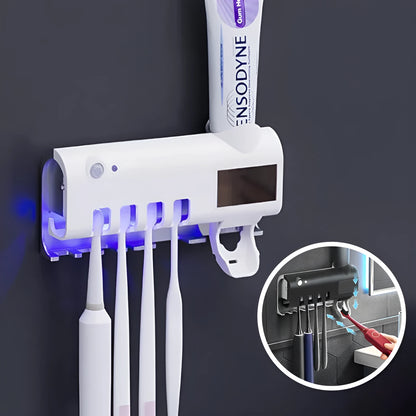 Black wall-mounted UV toothbrush steriliser with automatic toothpaste squeezer and solar panel.
