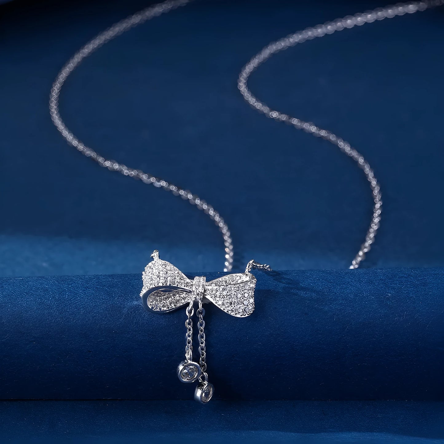 Silver bow pendant necklace with O-ring chain, adjustable 40-45cm length, 925 sterling silver composition