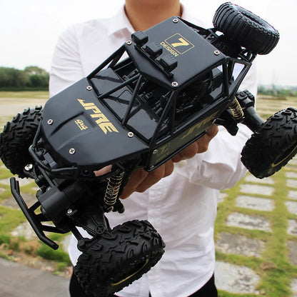 Four-wheel drive remote control car with 2.4G wireless controller on rough terrain
