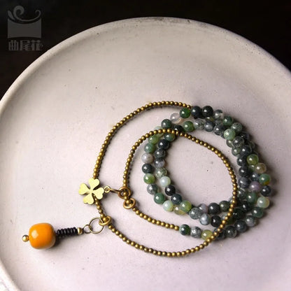 Children's multi-layered bracelet with natural crystal and semi-precious stone beads in ethnic national style design