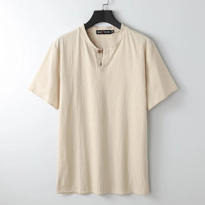 Women's loose fit apricot cotton V-neck short sleeve pullover top on a hanger.