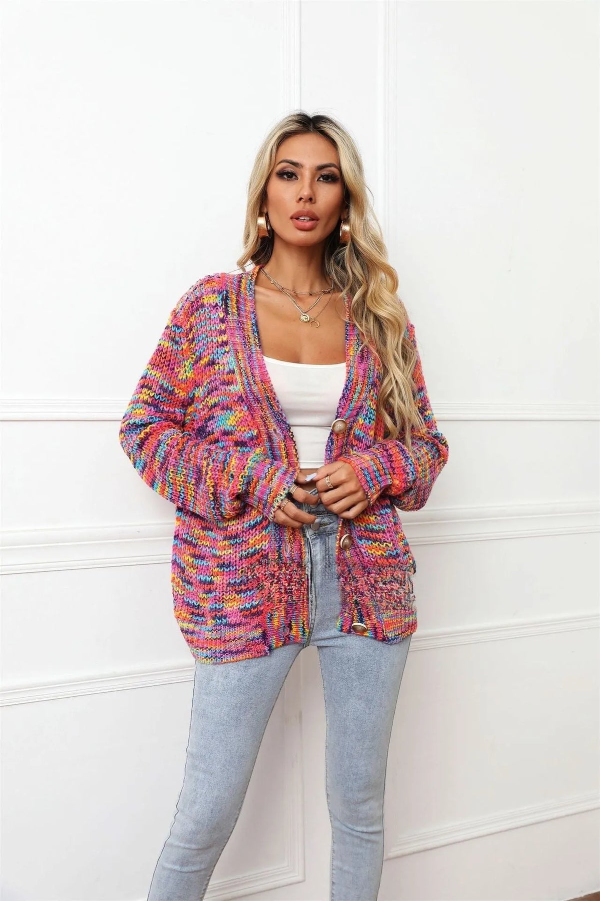 Rose Red rainbow dyed striped short cardigan knitted coat with loose fit on model.