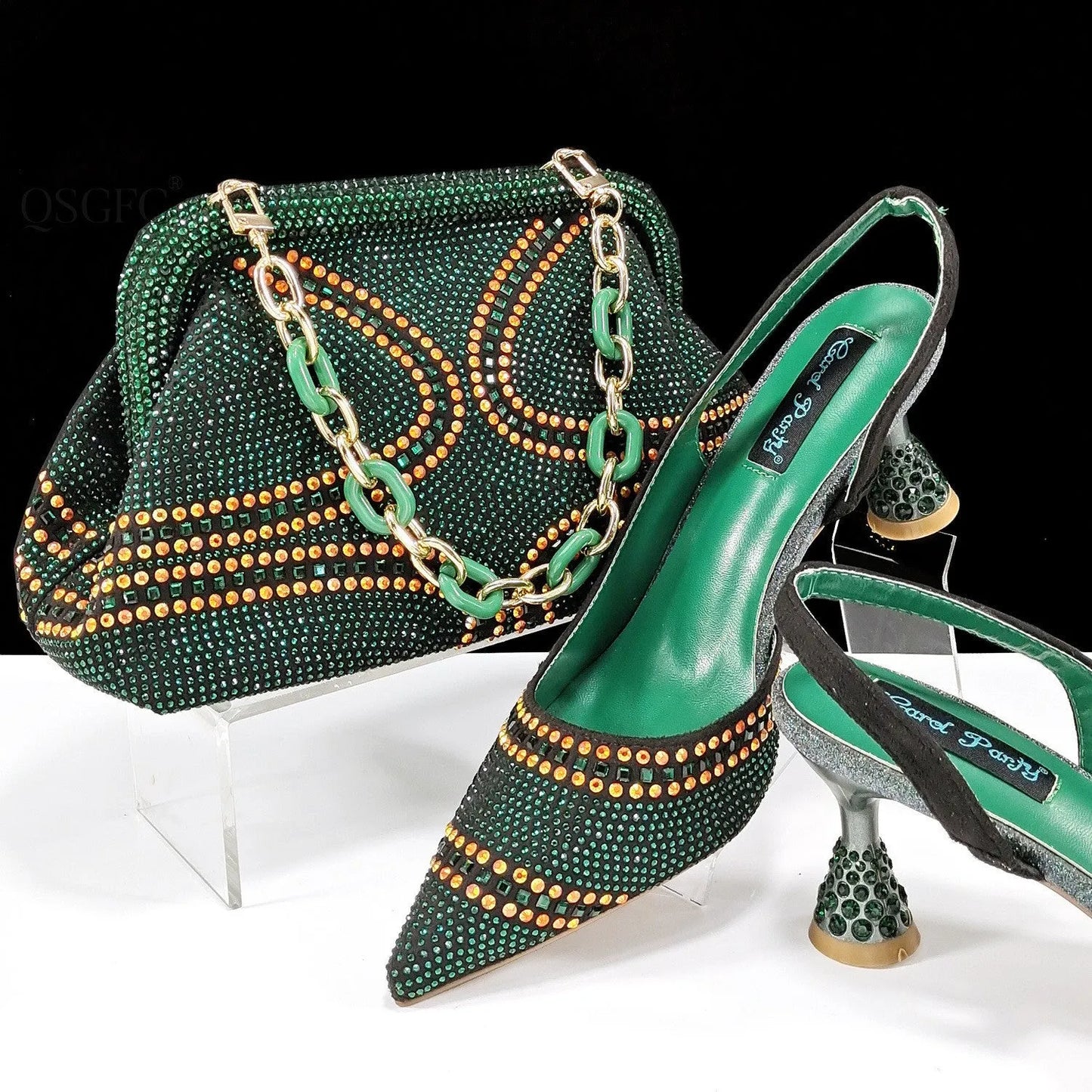 Women's pointed toe high heels with rhinestones and a matching small bag in blue.