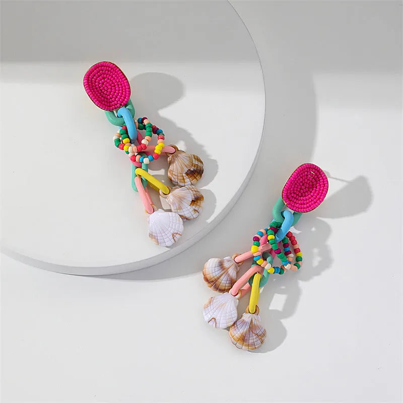 Handmade bohemian shell tassel earrings for women with colourful flower and geometric drop design