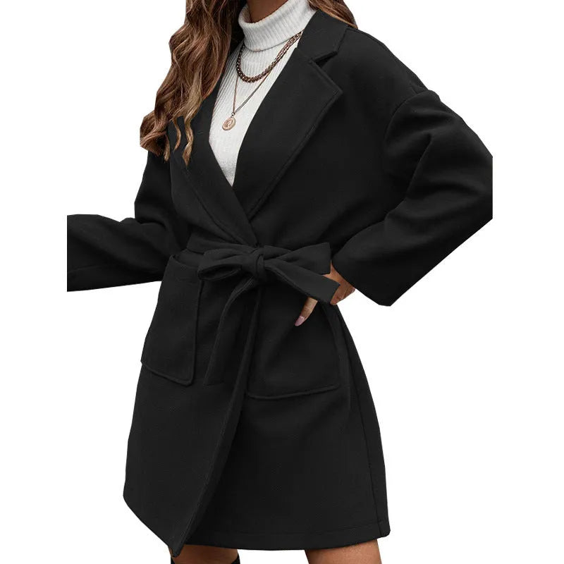 Brown loose fit minimalist coat with lapel buttons and integrated belt, showing regular sleeves and split design